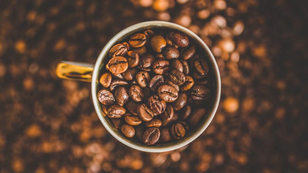 A close-up cup of coffee beans