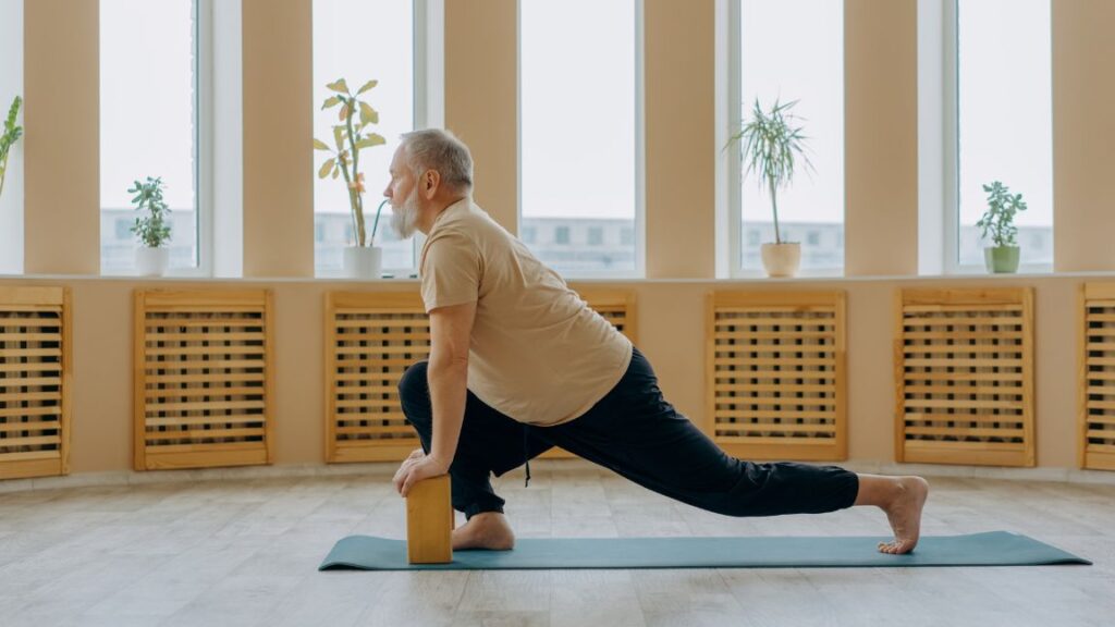 Senior man stretching doing a yoga pose