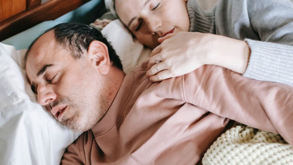 Older couple on the bed sleeping